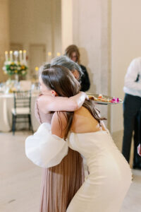 mom hugging her daughter as she gets married at a Minneapolis wedding